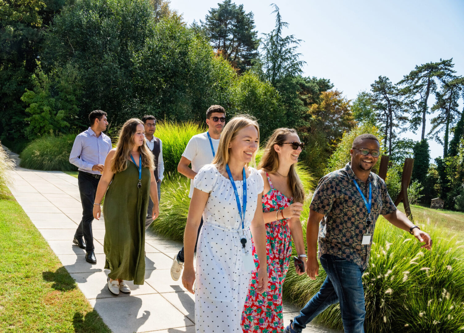 MBA_23_IMD_306-retouched 2 - IMD Business School IMD MBA students walking on campus - IMD Business School